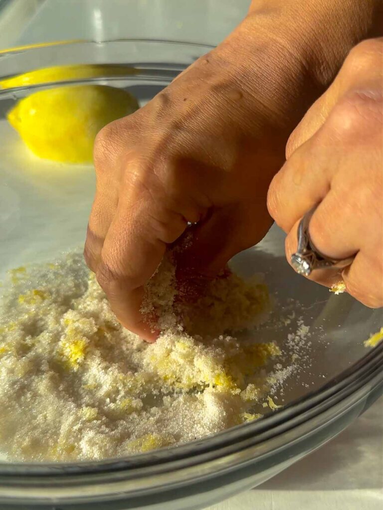 massaging lemon zest into sugar